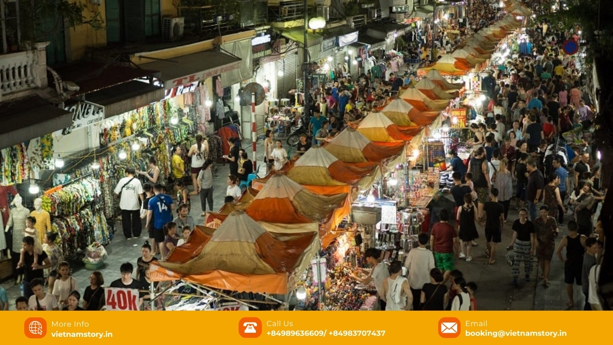 Vietnam Night Markets: A Vibrant Guide to Culture, Food & Shopping 3 Shoppers browse stalls under tents at the bustling Hanoi Old Quarter Night Market.