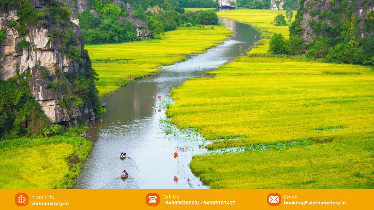 Your Ultimate Guide to 8 Amazing UNESCO World Heritage Sites in Vietnam 8 Boat navigating the scenic waterways surrounded by limestone karsts in Trang An Landscape Complex, Ninh Binh.
